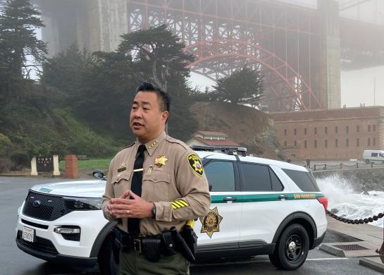 Sheriff Miyamoto stands at Fort Point near Golden Gate Bridge